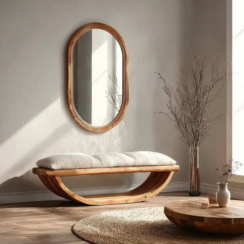 Modern entryway with live edge wood bench, oval cushion, oval mirror, and round wood table