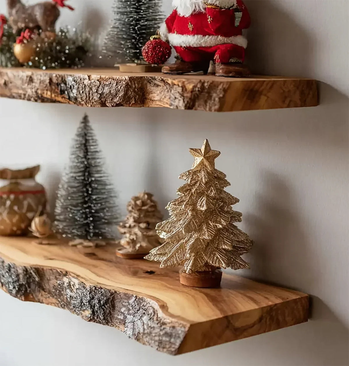 Decorative natural wood shelves with Christmas ornaments including golden and snowy trees, and Santa figure