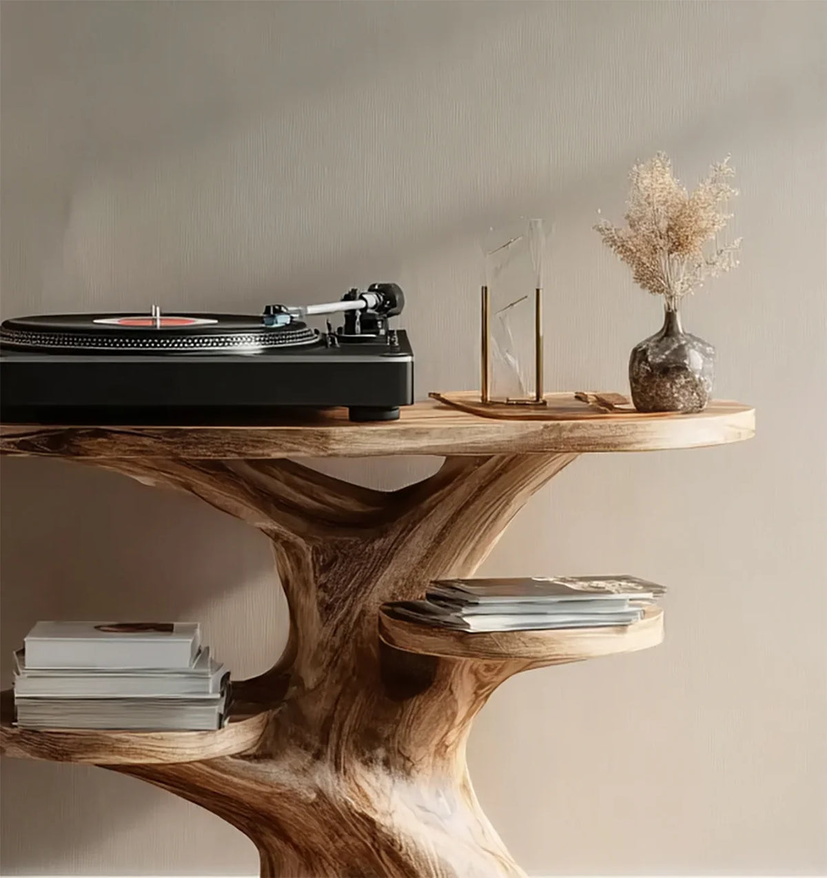 Black turntable with record on natural wooden stand alongside hourglass and dried flowers in vase