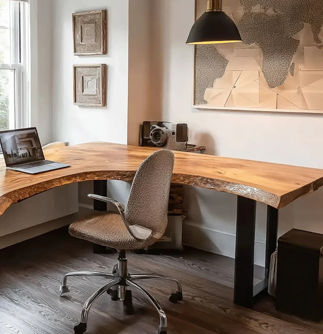 Live edge solid wood desk in modern home office with swivel chair and laptop