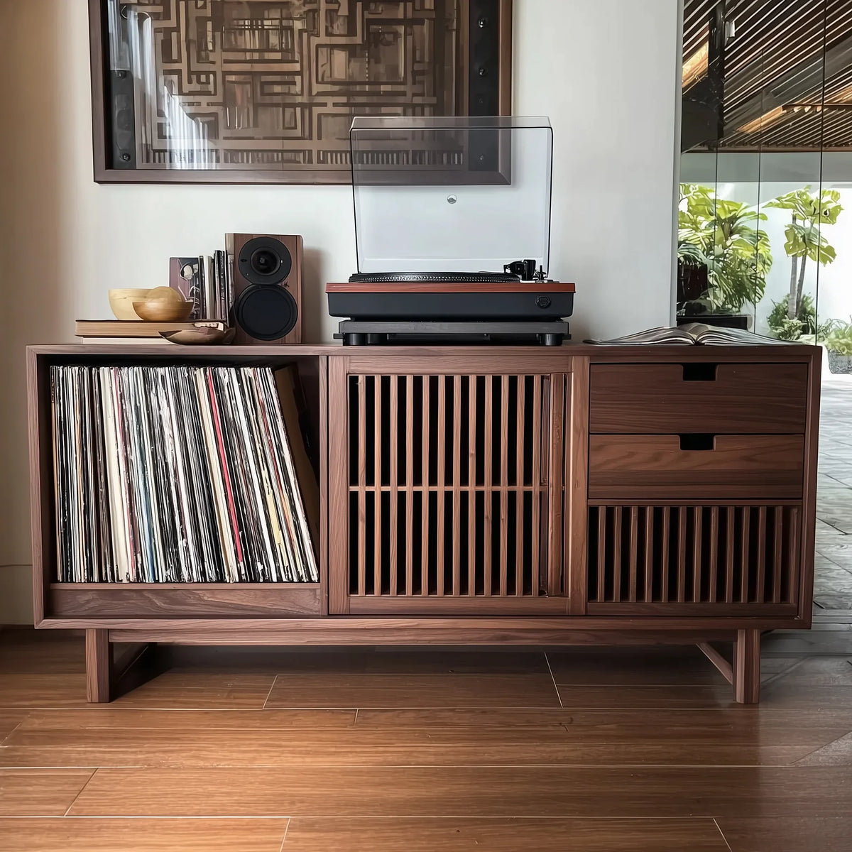 Wooden mid-century modern sideboard with turntable, vinyl records, speaker, and decorative bowls