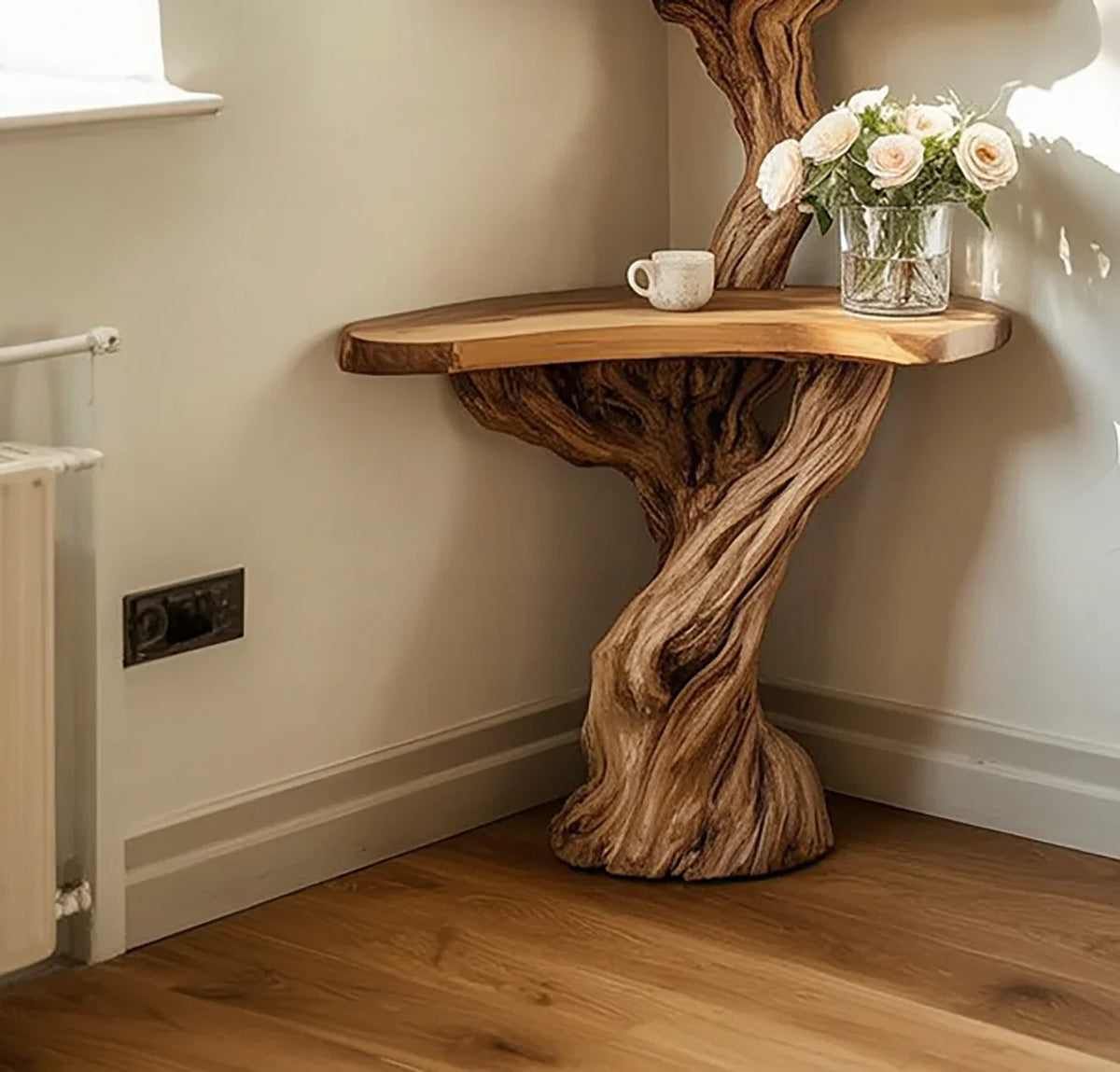 Live edge solid wood corner table with tree trunk base, vase of roses and cup on top