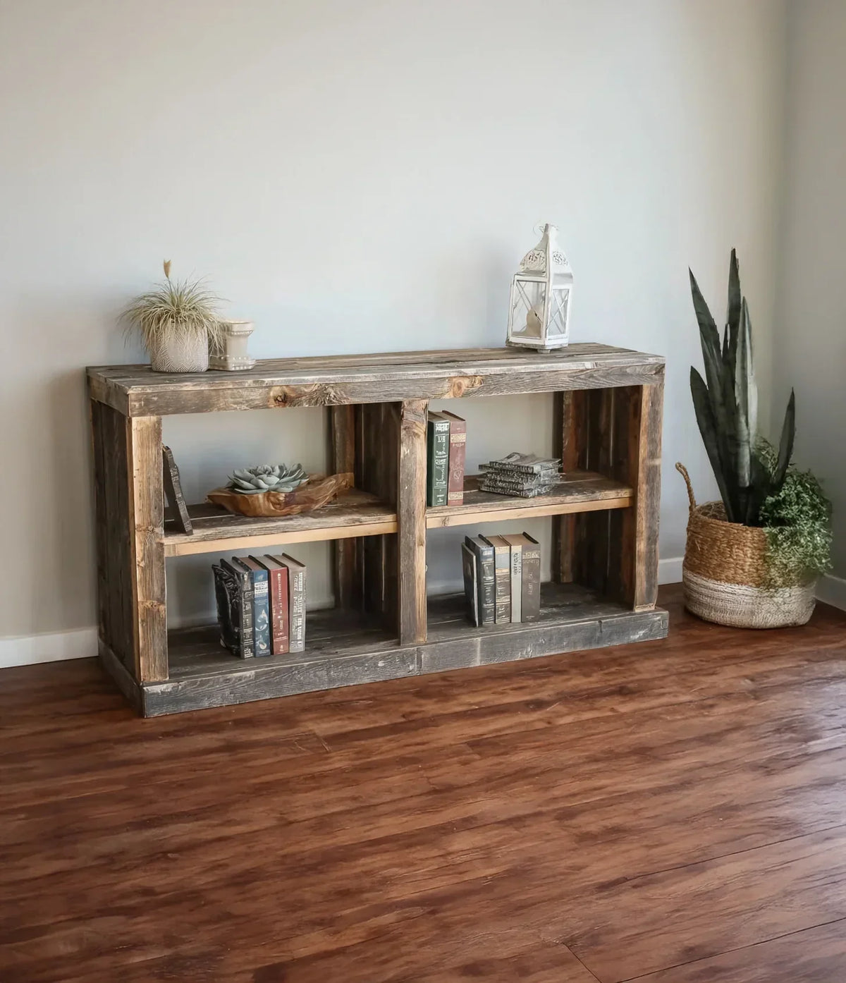 Rustic solid wood bookshelf with live edge, decorated with plants, books, and accessories