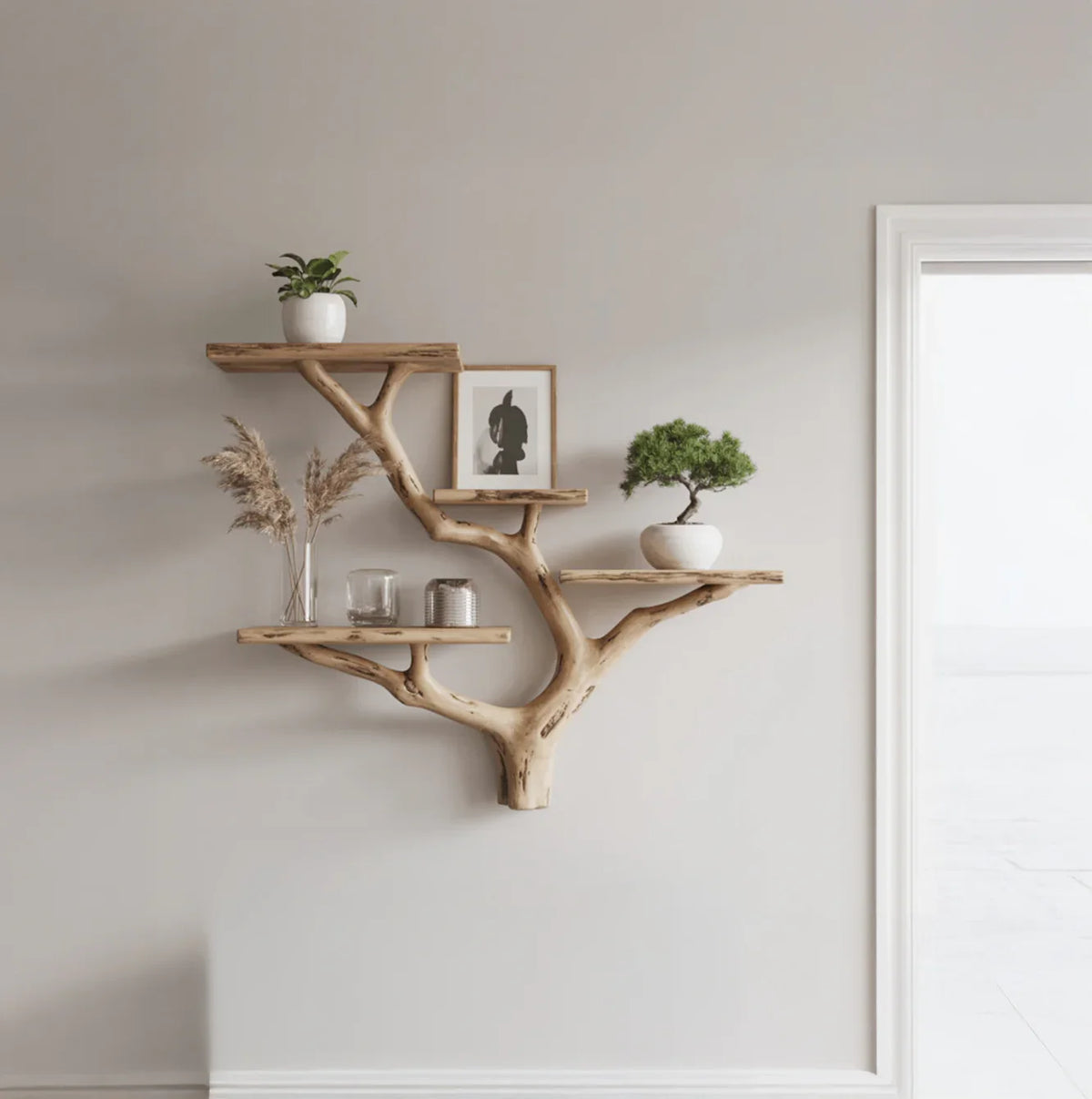 Live edge wooden tree bookshelf mounted on wall, decorated with plants and decor items