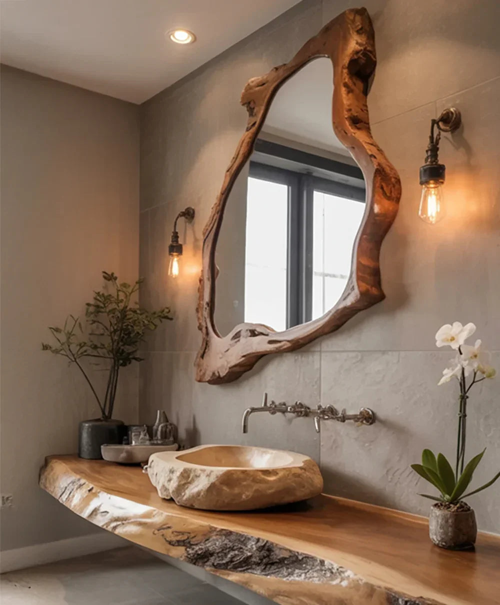 Live edge wood bathroom vanity with stone vessel sink, organic mirror, and wall sconces