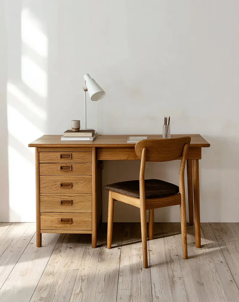 Solid wood desk and chair set with drawers in a minimalist home office setting