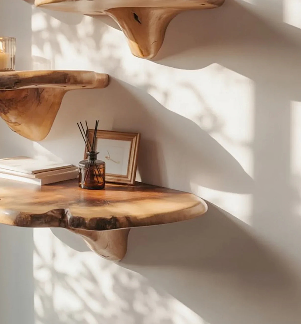 Live edge floating wood shelves on wall with decor and natural sunlight
