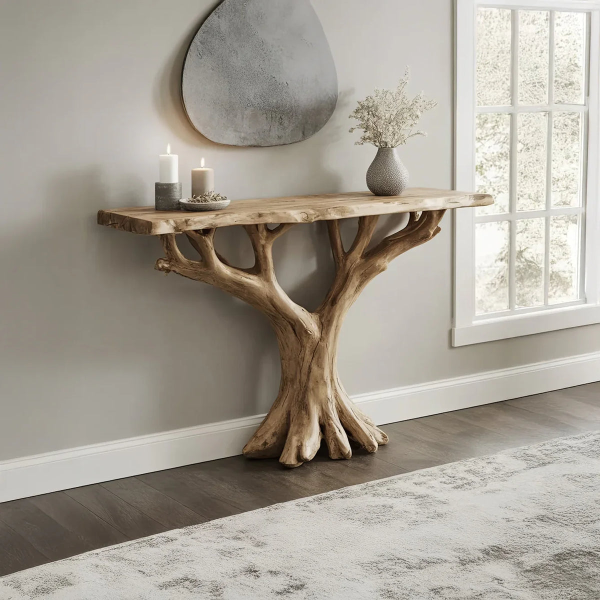 Live edge solid wood console table with tree branch base, styled in a modern living room.