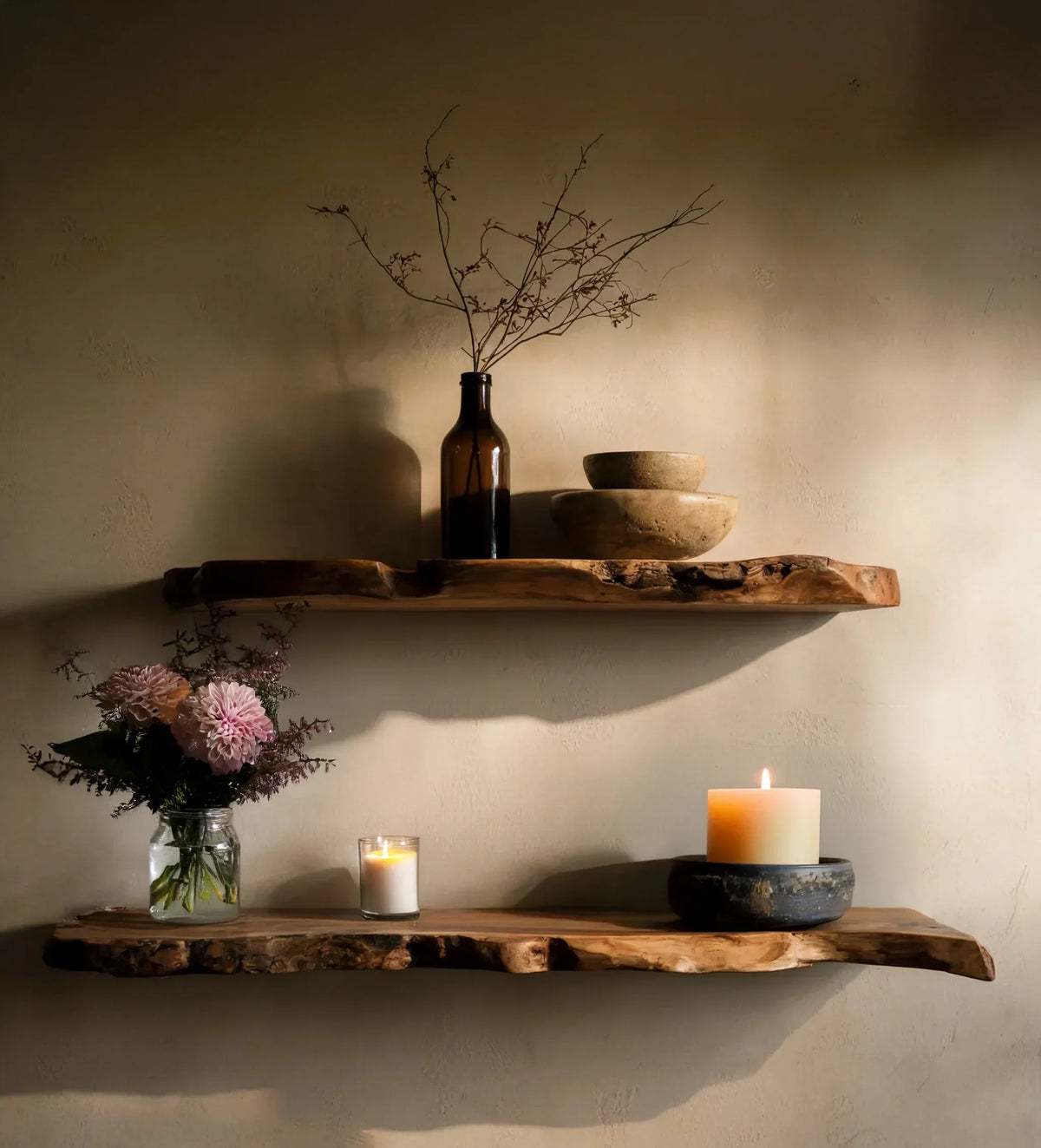 Sustainably crafted live edge wood floating shelves decorated with candles, vase, and bowls