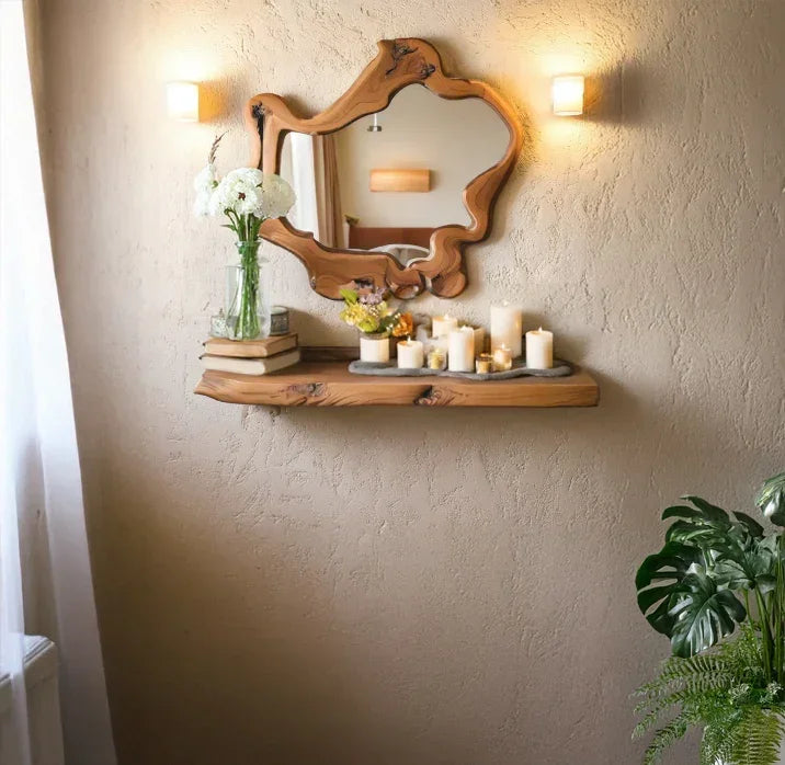 Live edge floating shelf with decorative candles, books, flowers, and rustic wood mirror