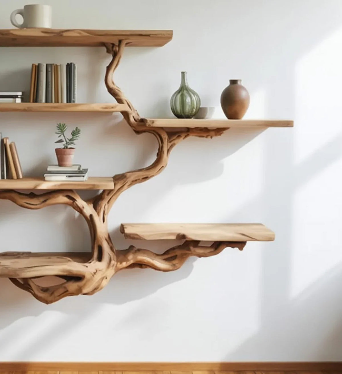 Live edge tree bookshelf with solid wood floating shelves, books, pottery, and decor items.