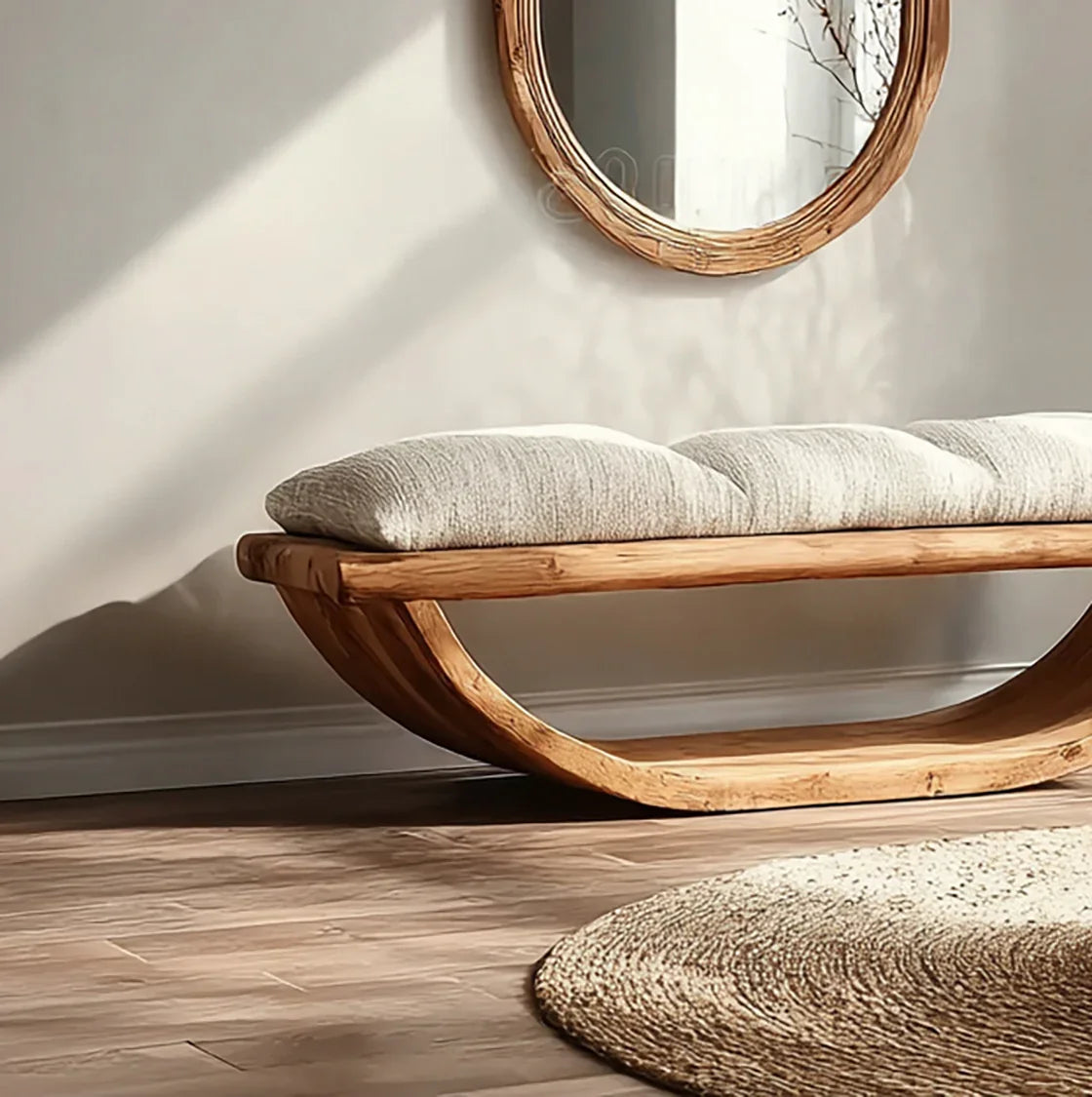 Sustainably crafted solid wood bench with curved base, padded cushion, and round wall mirror