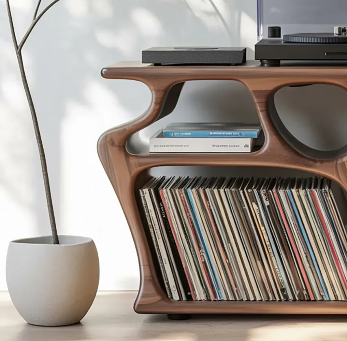 Modern solid wood record console with live edge design, vinyl storage, books, and potted plant