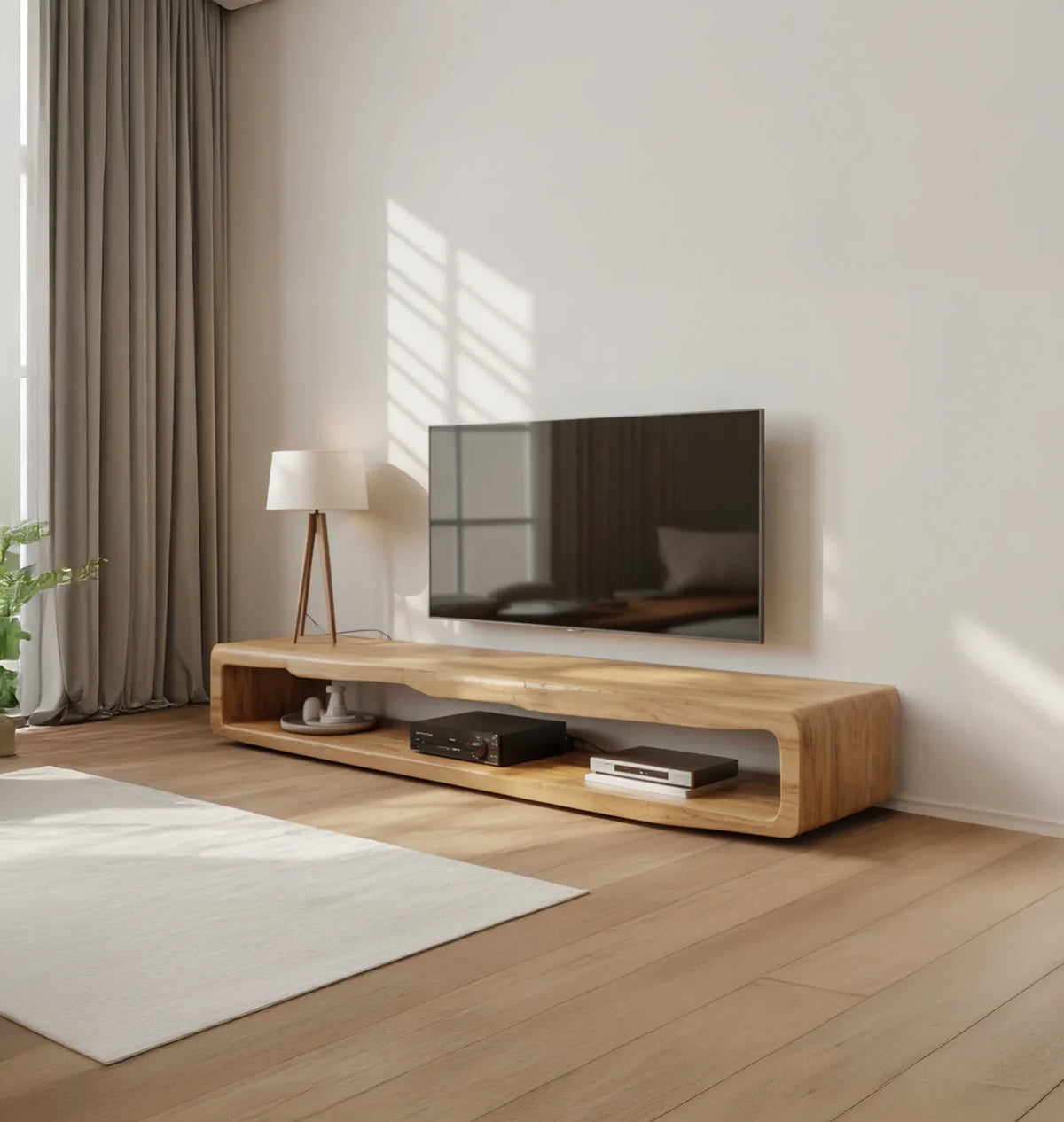 Minimalist living room with wall-mounted flat TV, wooden TV stand, tripod lamp, and beige curtains