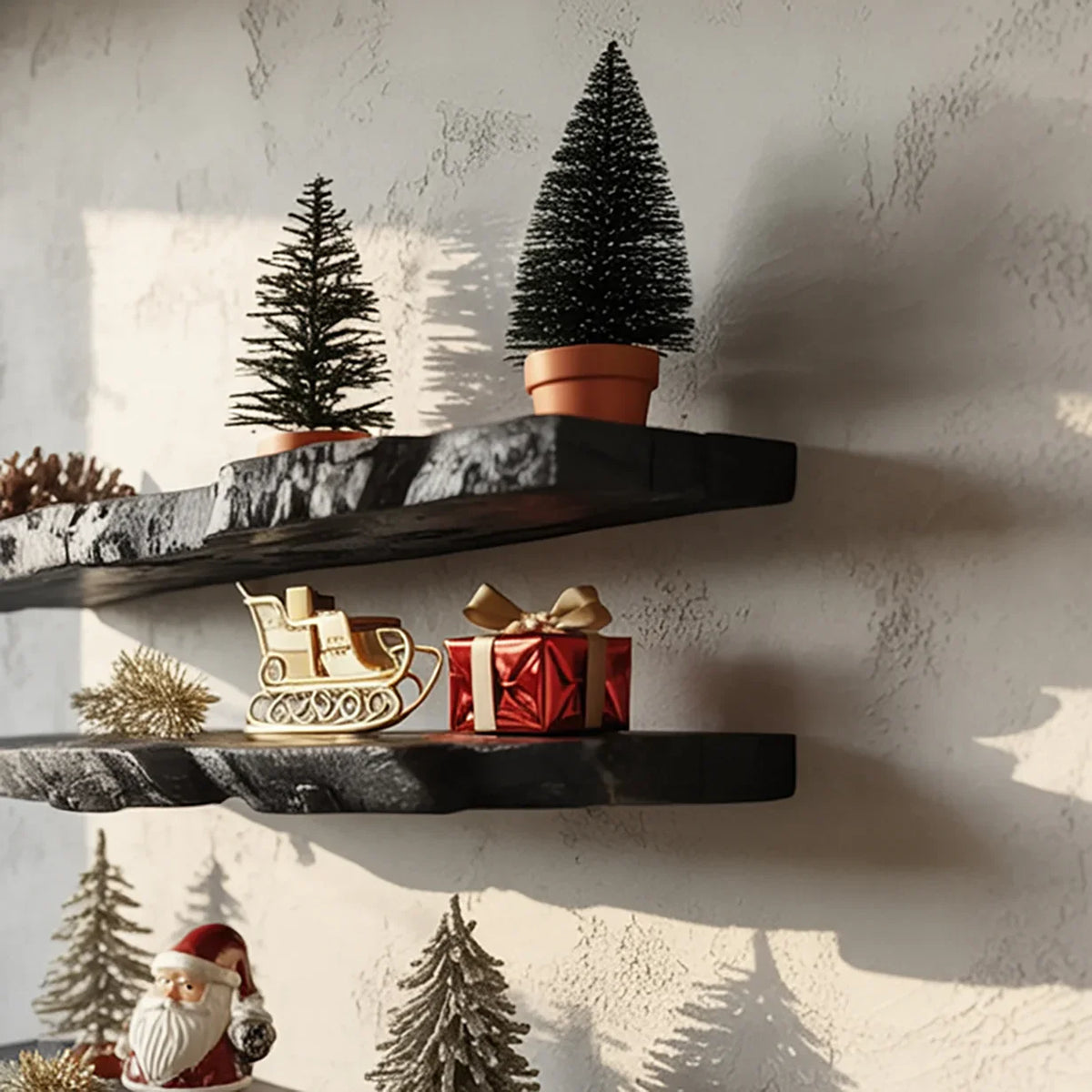 Wooden shelves with miniature Christmas trees, a gold sleigh decoration, and a red gift box against textured wall